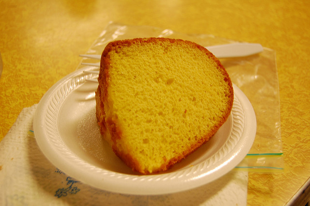 Photo of easy lemon pound cake on a Styrofoam plate.