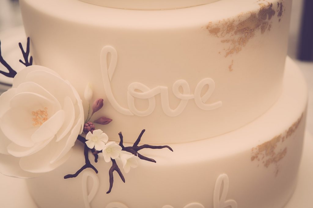 A wedding cake with the word love written on it